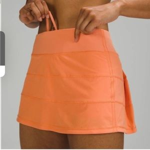 Lululemon Pace Rival mid rise skirt 12” vibrant dreamsicle color